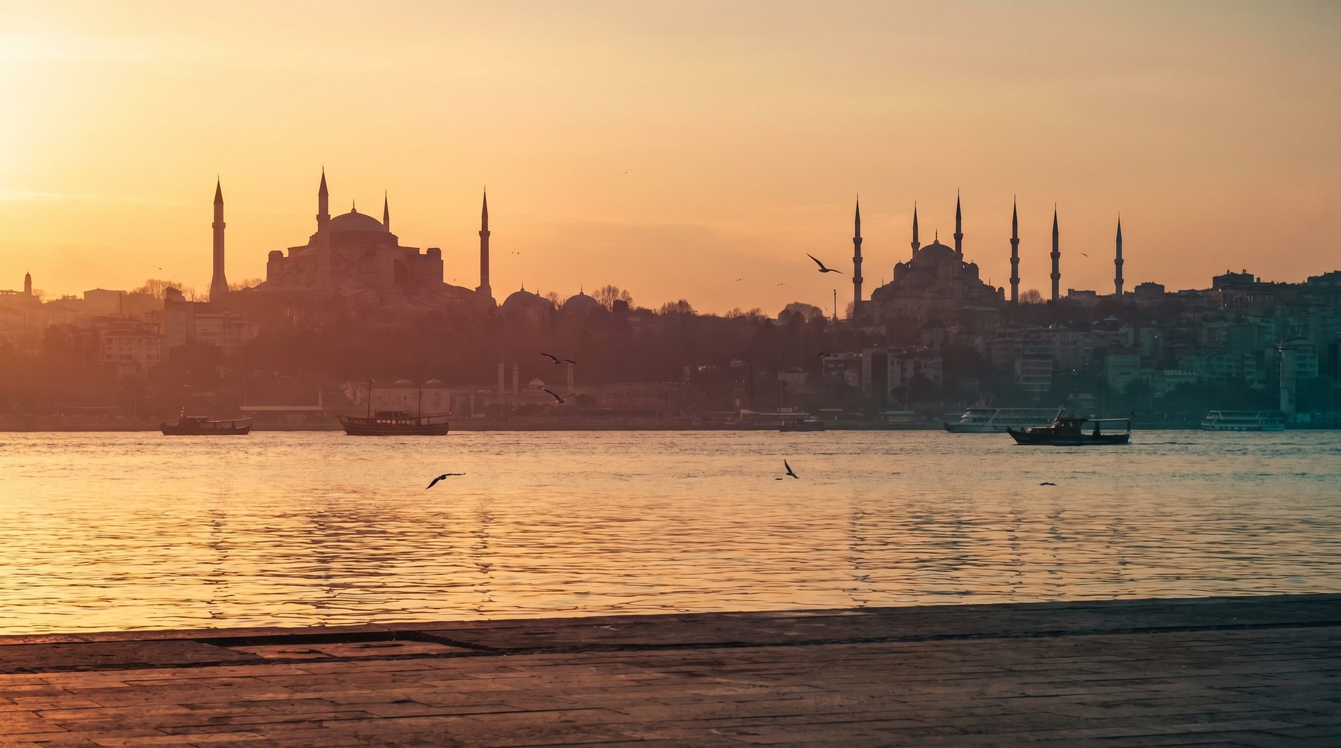 Istanbul at golden hour: the domes and minarets of the historic peninsula across the Bosphorus